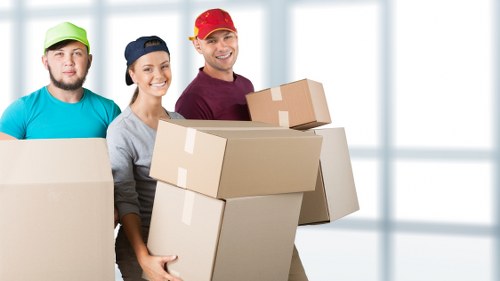 Worker securing items for transport in a removal van